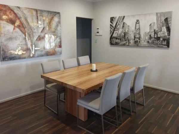 Australian made solid timber dining table in modern dining room setting with elegant decor.