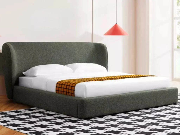 Miller Bed Frame with curved headboard and upholstered base, in a modern bedroom setting.