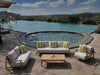 Bahama Outdoor Lounge Set by poolside, teak frame, white cushions, striped pillows.