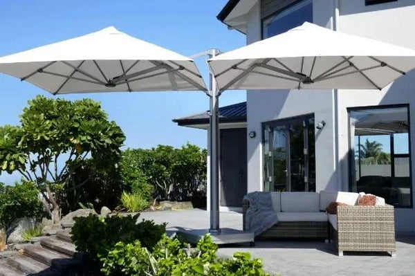 Unity Multi-Canopy Cantilever Outdoor Umbrella with two white canopies shading modern outdoor patio seating area