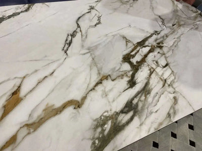 Ceramic extendable dining table with marble finish and steel legs.