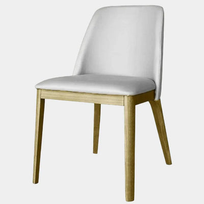 Kai Leather Dining Chair with white leather upholstery and timber frame.