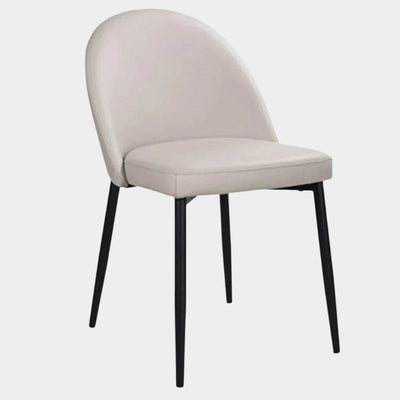 Liv Leather Dining Chair with wheat-colored upholstery and matte black legs.