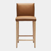 Marco Leather Bar Stool with tan leather and natural timber legs.