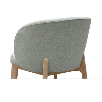 Oliva Fabric Dining Chair with solid timber legs in classic light grey fabric.