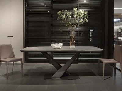 Spanish Marble Ceramic Dining Table with steel legs in elegant dining room setting.