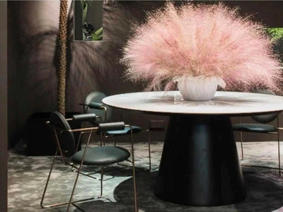 Viking Round Ceramic Top Dining Table with marble finish and sturdy black base in a modern dining setting.