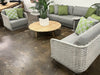 Acri Outdoor Lounge 1 Seater Sofa with rope weaving and green cushions displayed in a modern patio setting.
