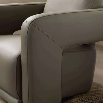 Aria Leather Armchair with enveloping armrests and sleek, modern design in premium leather.