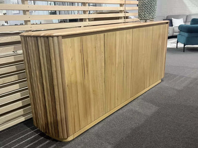 Ashford Buffet with curved edges and fluted detailing in a contemporary setting.