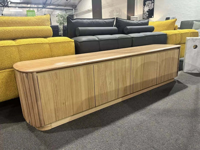 Minimalist Ashford TV Unit with sleek rounded corners and concealed storage in a modern living room.