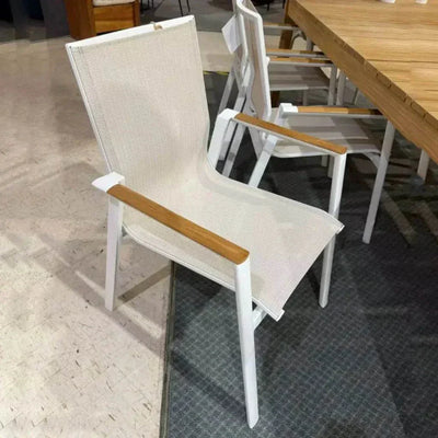 Aspen Outdoor Arm Dining Chair with powder-coated aluminum frame and teak slats in a patio setting.