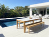 Atoll Ceramic Top Teak Dining Table with 12mm ceramic top and teak frame on outdoor patio by pool