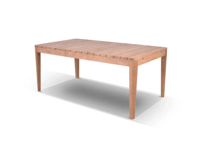 Outdoor extendable teak dining table with bolt-on legs in a garden setting