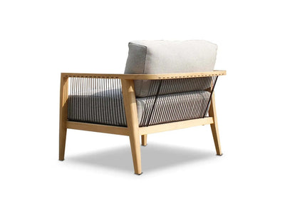Tribu Outdoor Lounge 1 seater outdoor sofa with teak frame, rope detailing, and gray Sunbrella cushions