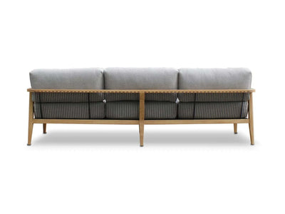 Back view of Tribu Outdoor Lounge 3 Seater sofa with teak frame and grey cushions