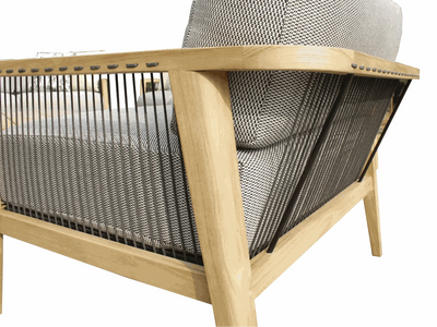 Tribu Outdoor Lounge single-seat outdoor sofa with teak frame and rope detailing, gray Sunbrella cushions