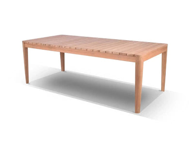 Atoll Outdoor Teak Dining Table made from A Grade teak with bolt-on legs in an outdoor setting