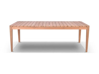 Atoll Outdoor Teak Dining Table with natural A Grade teak and bolt-on legs in outdoor setting
