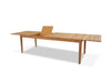 Atoll outdoor teak extendable dining table with one extension leaf raised