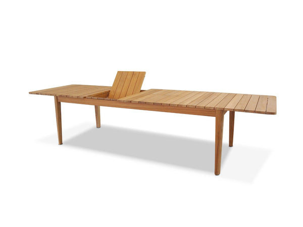 Atoll outdoor teak extendable dining table with one extension leaf raised