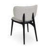 Avery Dining Chair with oatmeal fabric upholstery and stained black legs, featuring a curved backrest and cushioned seat for comfort