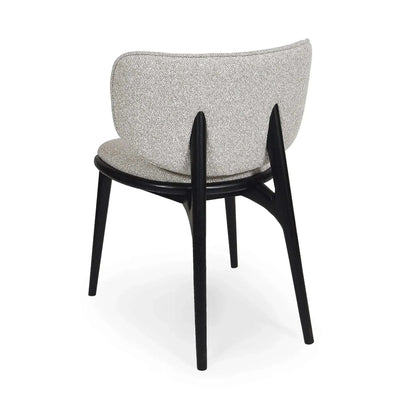Avery Dining Chair with oatmeal fabric upholstery and stained black legs, featuring a curved backrest and cushioned seat for comfort