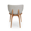 Avery Dining Chair with curved backrest, oatmeal fabric upholstery, and natural oak legs viewed from the back.