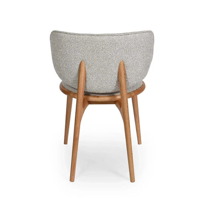 Avery Dining Chair with curved backrest, oatmeal fabric upholstery, and natural oak legs viewed from the back.