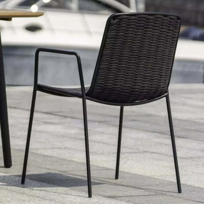 Bella Outdoor Dining Chair with rope weave and powder-coated frame by a pool setting.