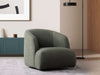 Bon Armchair in modern living room setting, green upholstery.