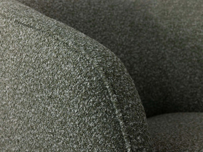 Bon Armchair with textured fabric upholstery in close-up view.