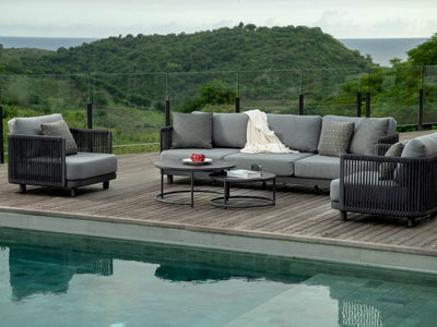 Bonito Outdoor Lounge - 3 Seater Sofa on a wooden deck by the pool, featuring modern design and charcoal finish.