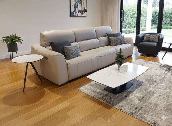 Bordeaux 3.75 Seater Recliner Sofa in modern living room with light grey leather and multiple cushions