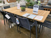 Breeze teak outdoor dining table with six black Milan Dallas chairs in Black November Sale at Taste Furniture Adelaide