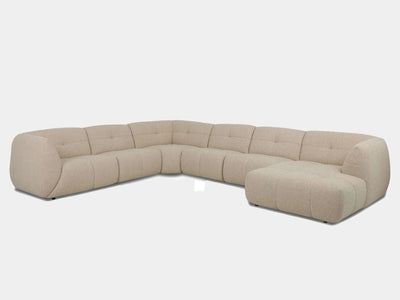Bric 7.5 Seater Corner Sofa with Chaise in beige fabric, featuring plush cushions and sleek contemporary design.