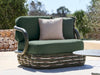 Canasta 1 seater outdoor sofa styled in a contemporary outdoor setting