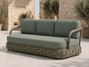 Canasta 3 seater outdoor sofa styled in an outdoor setting
