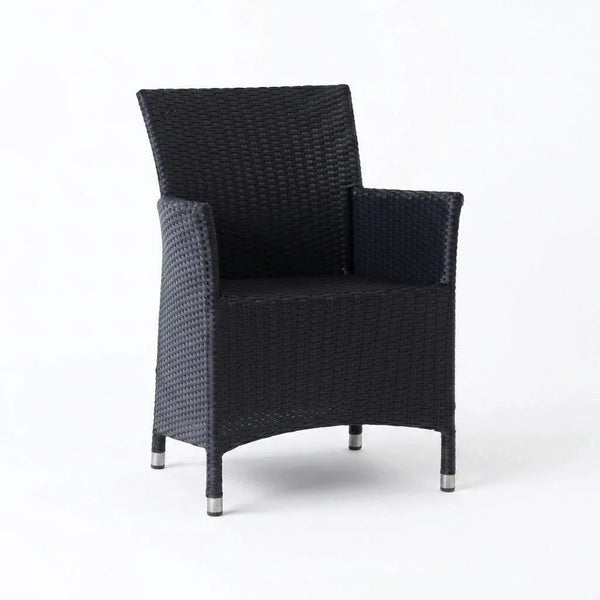 Caribbean Outdoor Dining Chair with handwoven synthetic rattan and powder-coated aluminum frame on patio