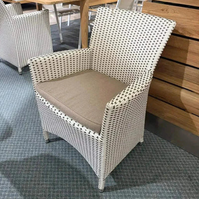 Caribbean Outdoor Dining Chair with handwoven synthetic rattan and powder-coated aluminum frame, featuring optional seat cushion.