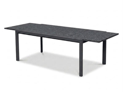 Cebu Outdoor Ceramic Extendable Dining Table with aluminum base and ceramic top in outdoor setting