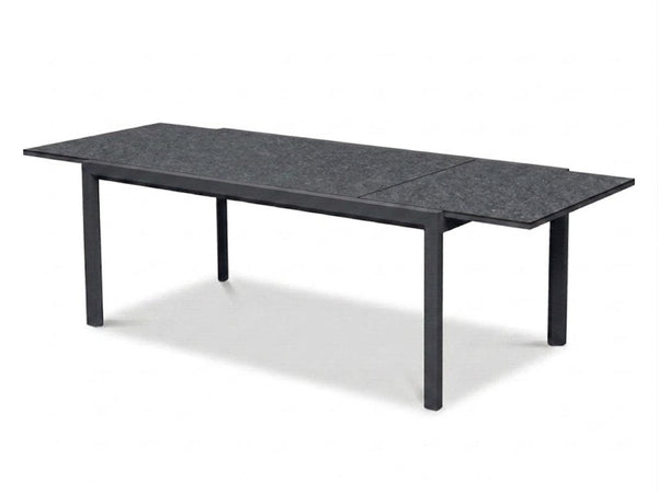 Cebu Outdoor Ceramic Extendable Dining Table with aluminum base and ceramic top in outdoor setting
