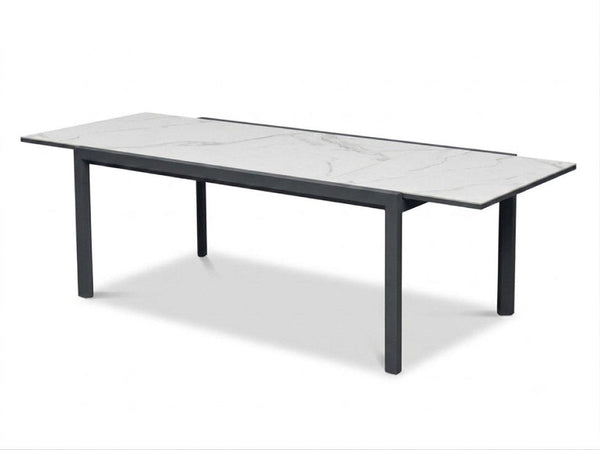 Cebu Outdoor Ceramic Extendable Dining Table with aluminum base and sleek 6mm ceramic top in outdoor setting