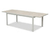 Cebu Outdoor Ceramic Extendable Dining Table with aluminum base and ceramic top in outdoor setting