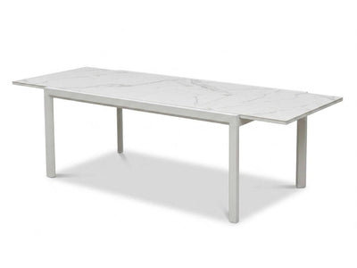 Cebu Outdoor Ceramic Extendable Dining Table with aluminum base and ceramic top in outdoor setting
