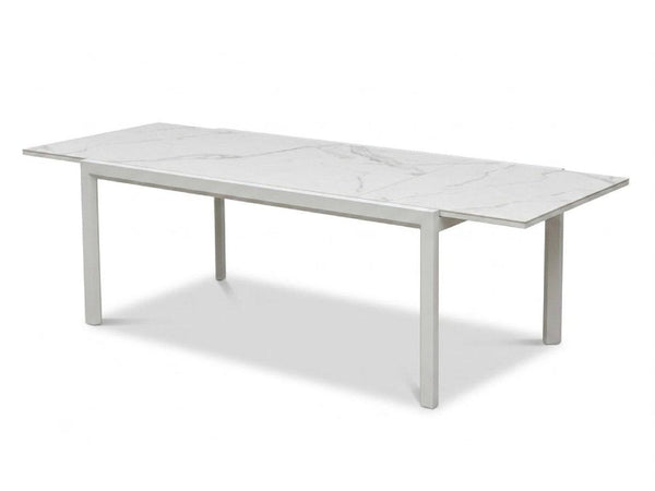 Cebu Outdoor Ceramic Extendable Dining Table with aluminum base and ceramic top in outdoor setting