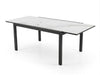 Outdoor ceramic extendable dining table with aluminium base and sleek ceramic top in modern patio setting