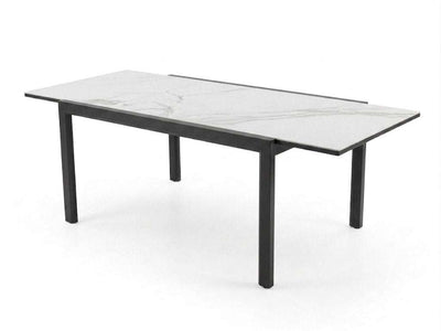 Outdoor ceramic extendable dining table with aluminium base and sleek ceramic top in modern patio setting