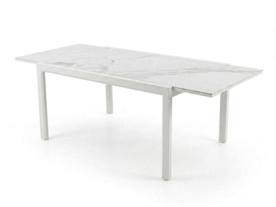 Outdoor ceramic extendable dining table with aluminium base set in garden