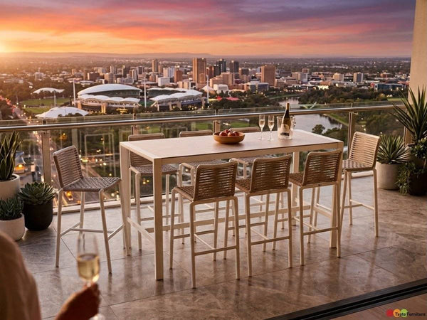 Cebu Outdoor Ceramic Bar Table with white aluminium frame and smooth white ceramic top paired with woven beige bar stools.